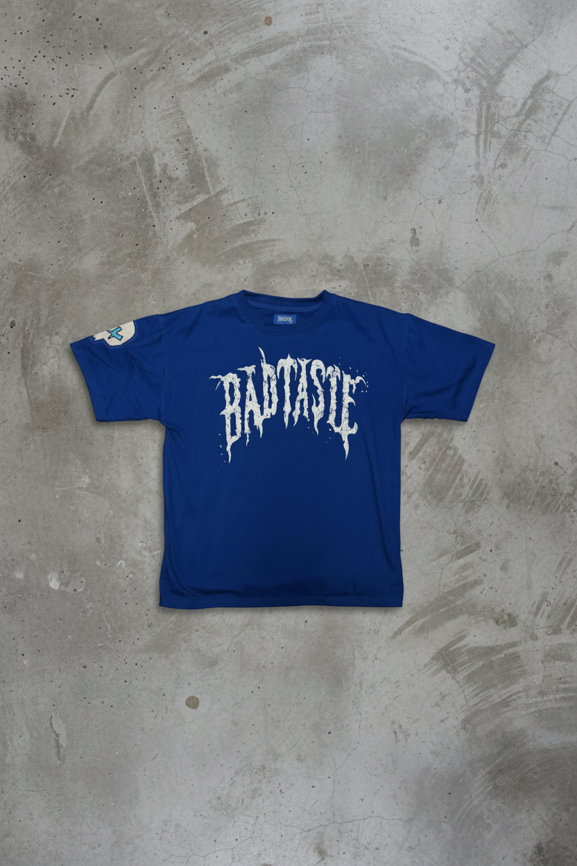BADTASTE Blue Tee on Concrete