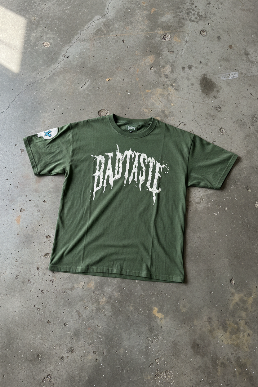BADTASTE Green Tee on Concrete